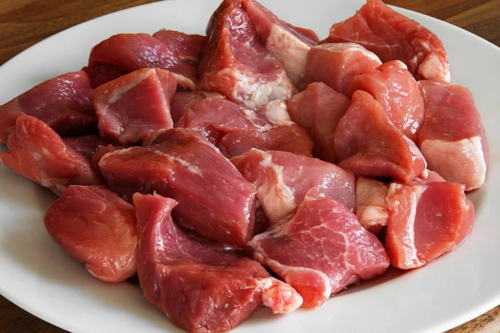 raw meat on a white plate